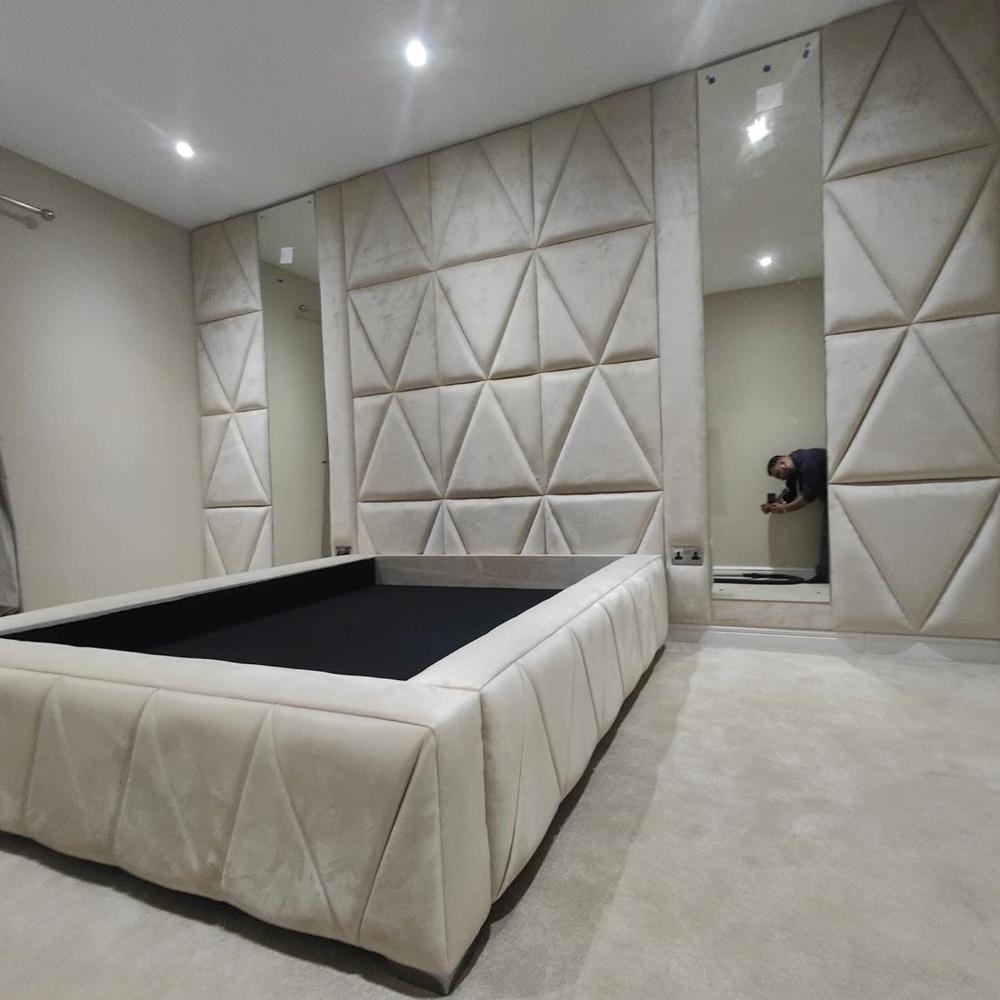 Elegant bedroom interior featuring a Luxury Geometric Wall Panel Bed Frame with padded triangular wall panels