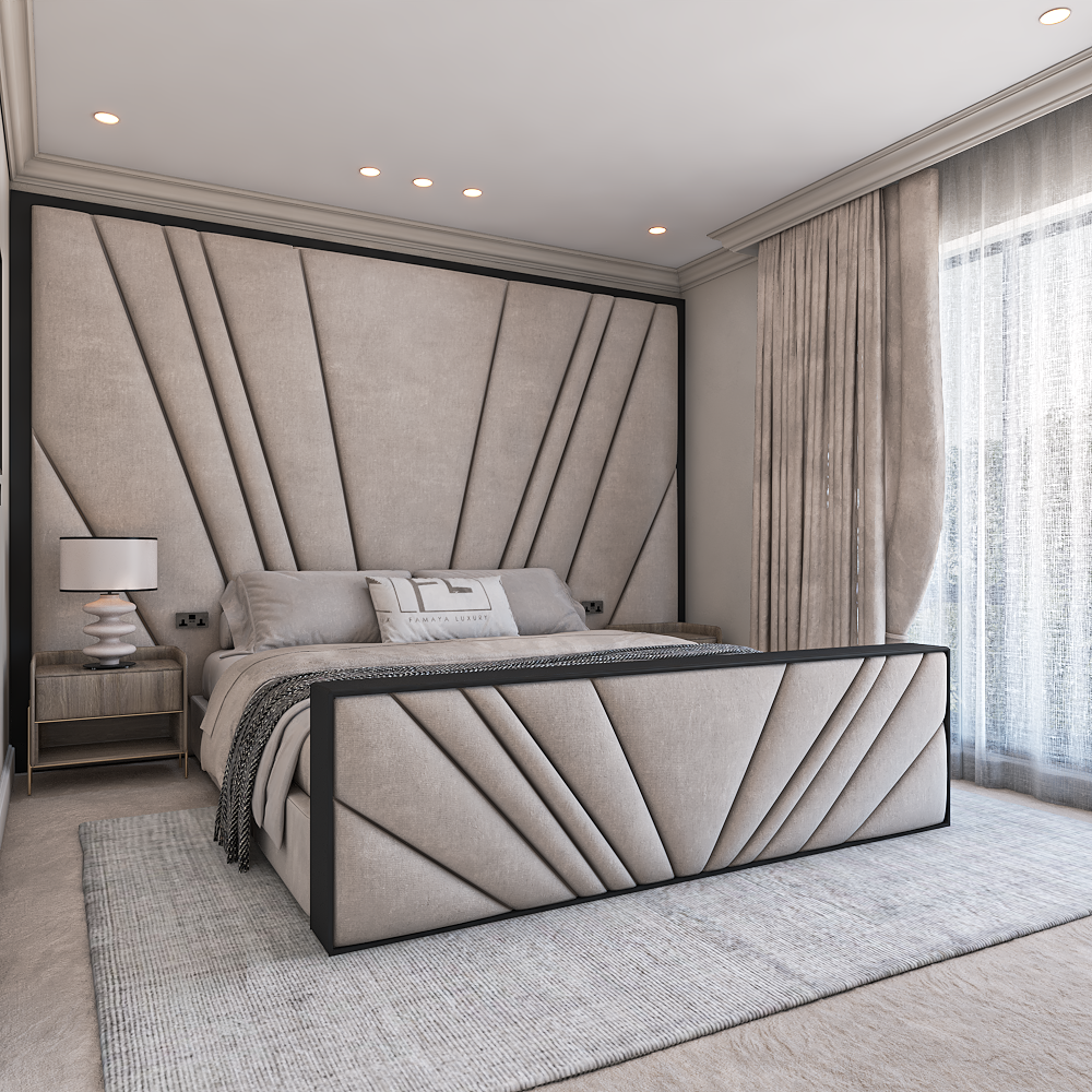 A bedroom featuring "The Freya Noir designer footend" bed, upholstered in a light beige fabric with dark trim.
