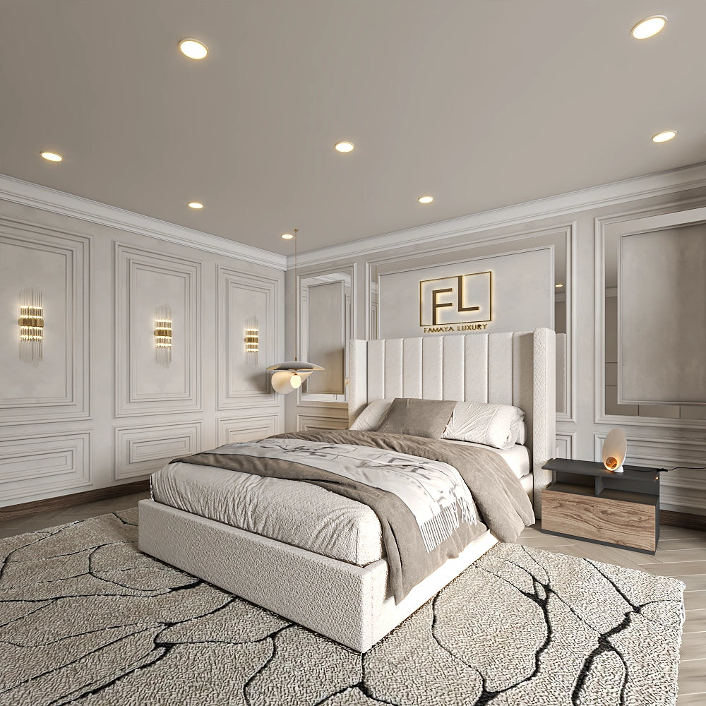 A modern bedroom with an upholstered bed, neutral bedding, wooden nightstands, decorative wall paneling and patterned rug.