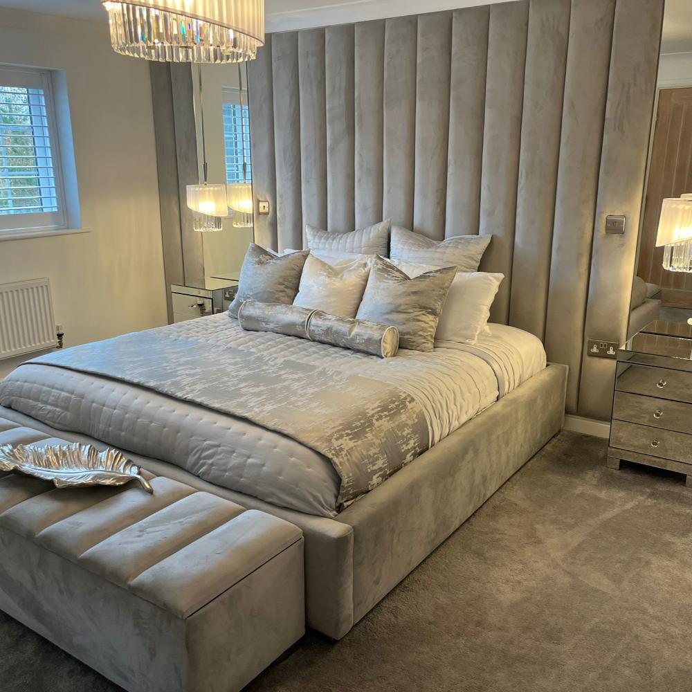 Luxurious bedroom with a high headboard bed and elegant decor.