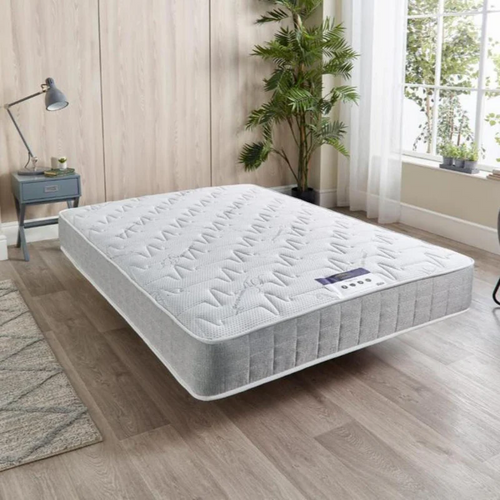 orthopedic  mattress King-size  in a modern bedroom with natural light.