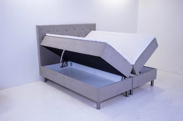 Small double ottoman bed side lift showing storage space.